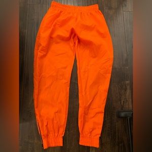 Bright neon orange pants